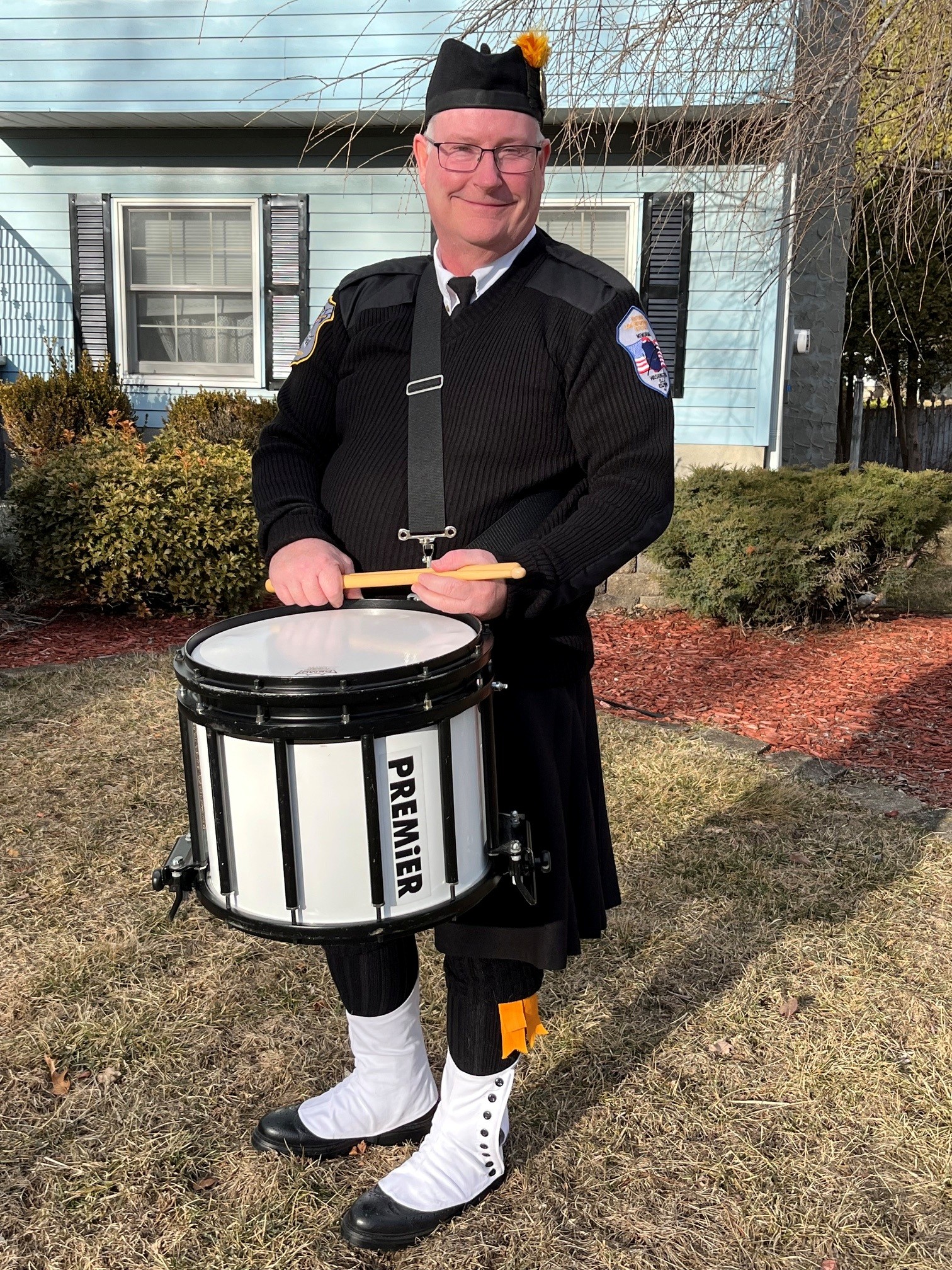 Steve playing snare drum with Police Pipes and Drums of Morris County